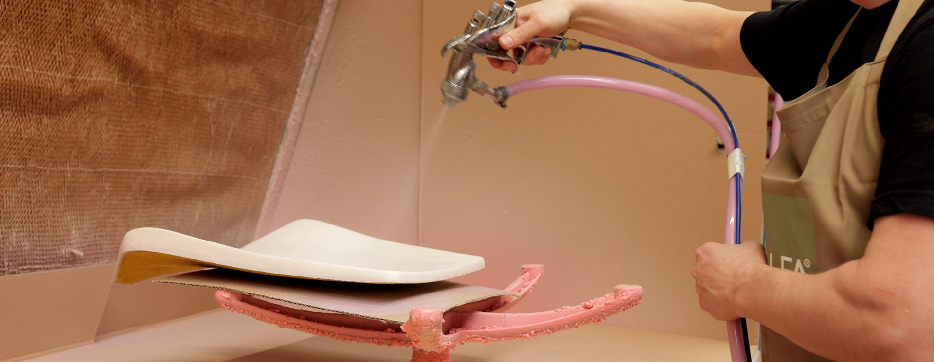 Applying adhesive to a seat component